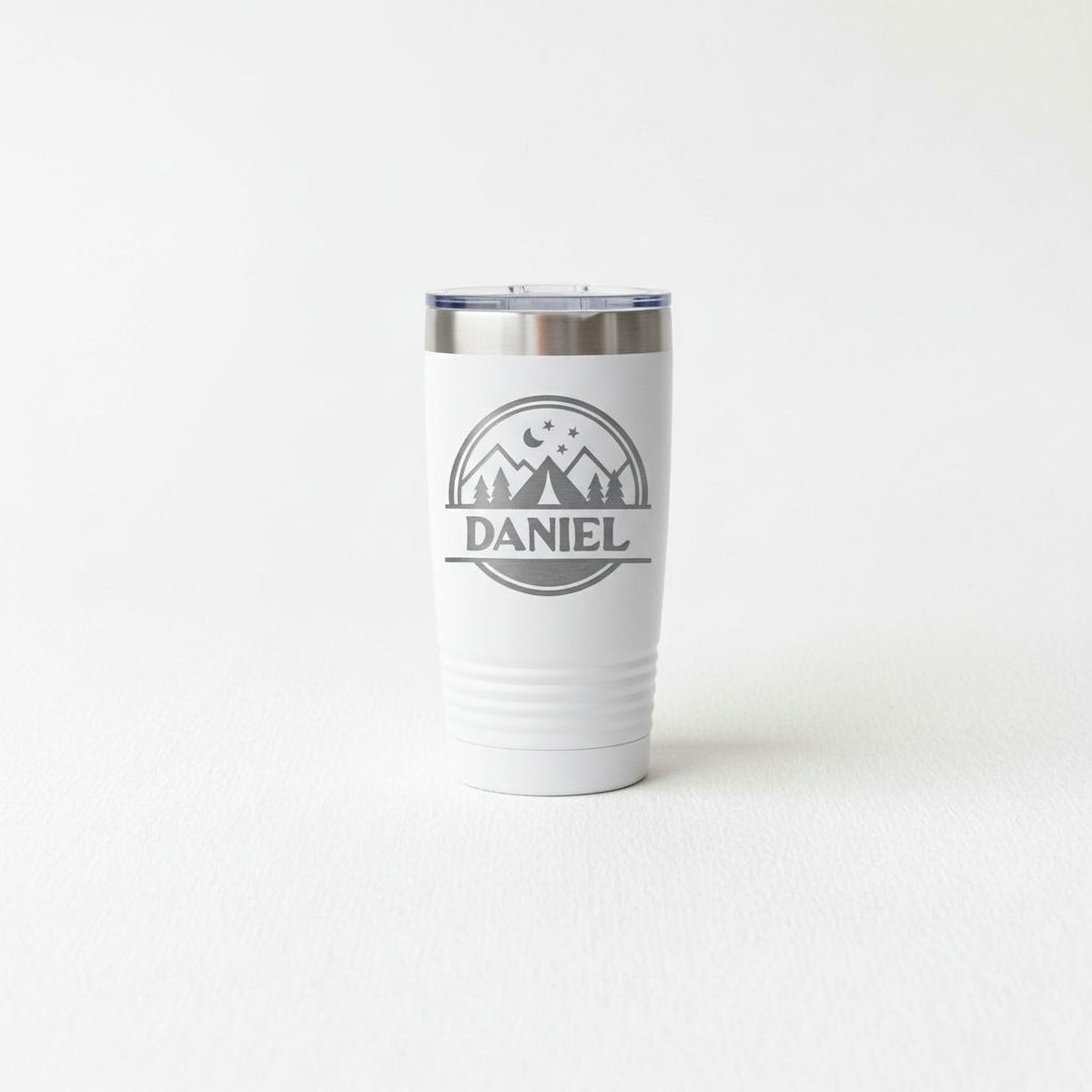 A white insulated tumbler with a lid and a logo that says "DANIEL".