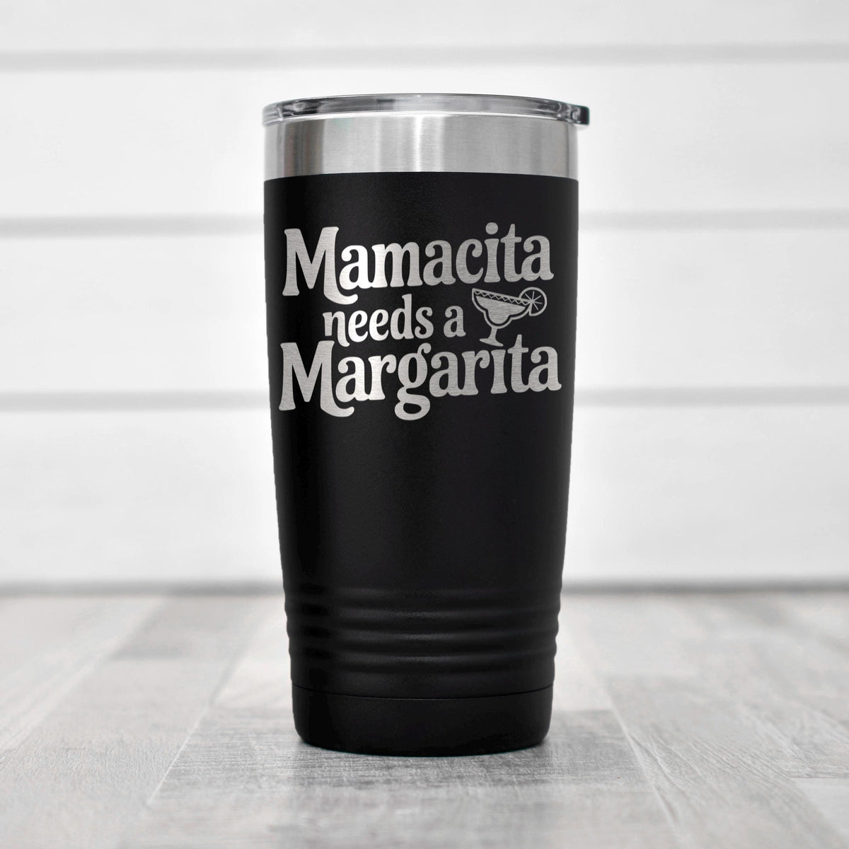 A black insulated tumbler with the text "Mamacita needs a Margarita" printed on it.