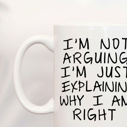 A white mug with black text on it.