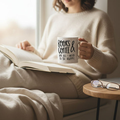 A person is sitting on a bed, holding a mug with the text "Books & Coffee are all I need to be happy" while reading a book.