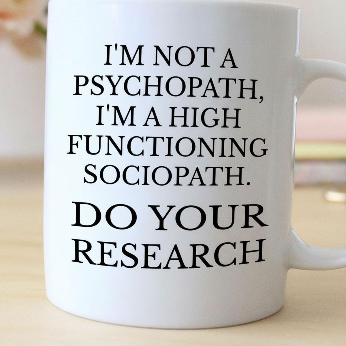 A white mug with black text on it.