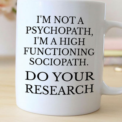 A white mug with black text on it.