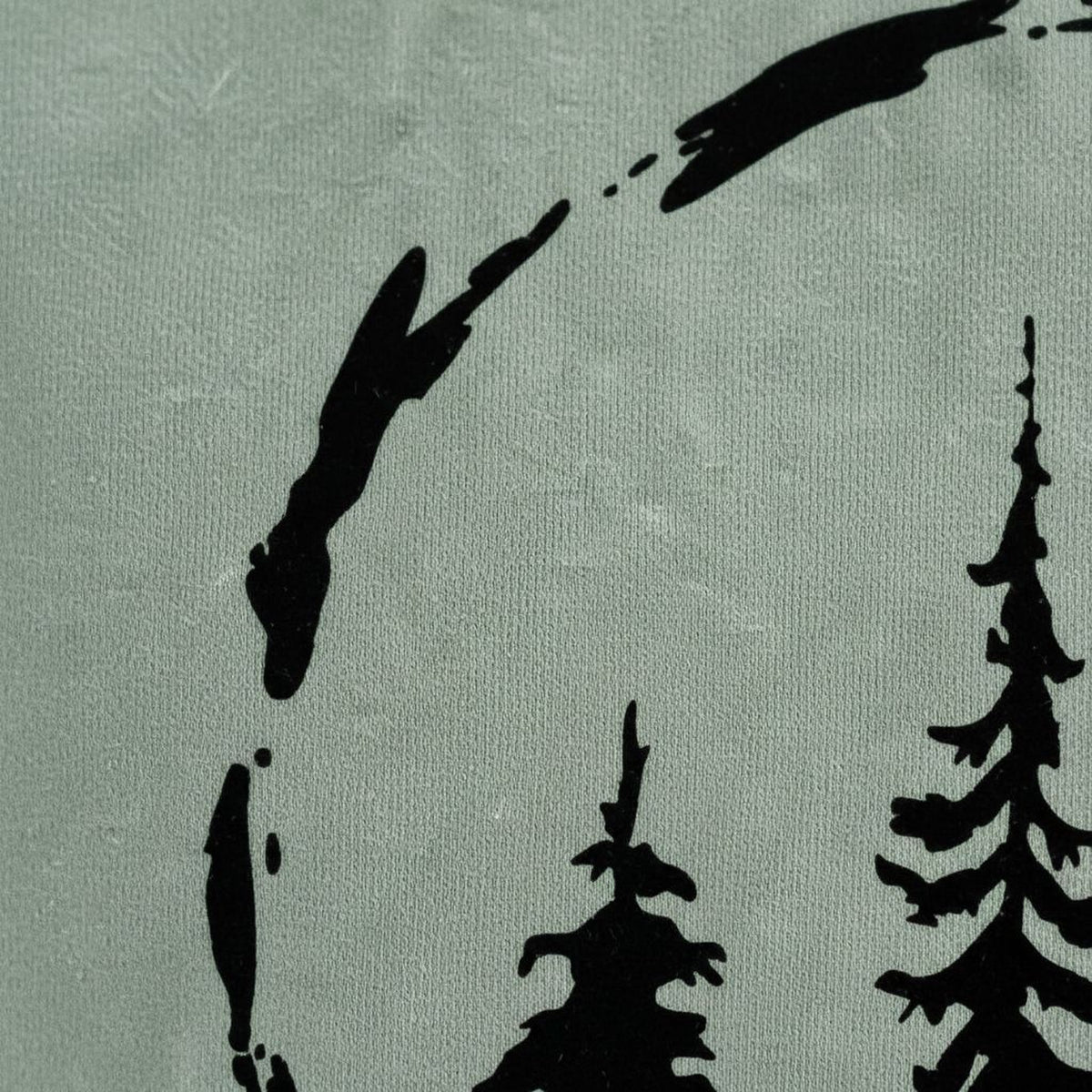 silhouettes of trees against a grey background.