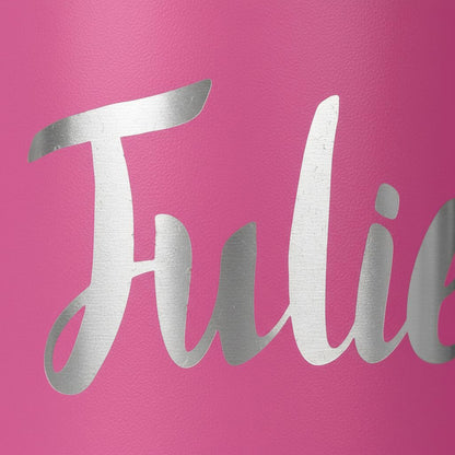 A close-up image of a pink background with the word "Julie" written in silver cursive font.
