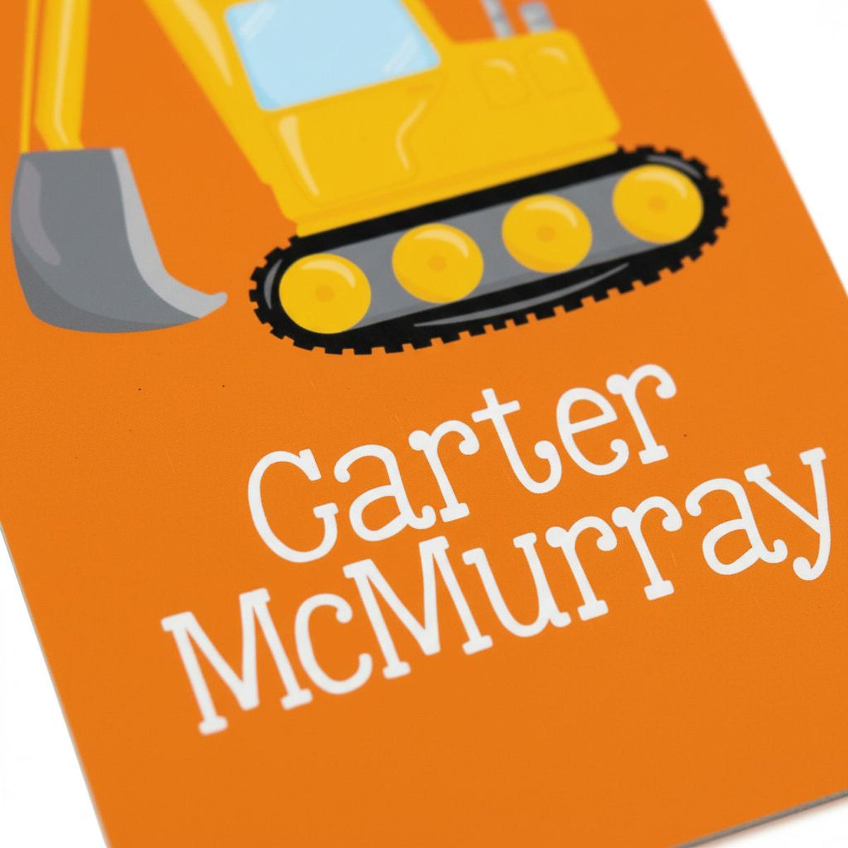 a close-up of a yellow construction vehicle with the name "Garter" and "Mcmurray" written on an orange background.