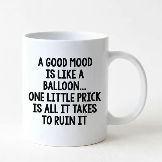 A white ceramic mug with black text printed on it.