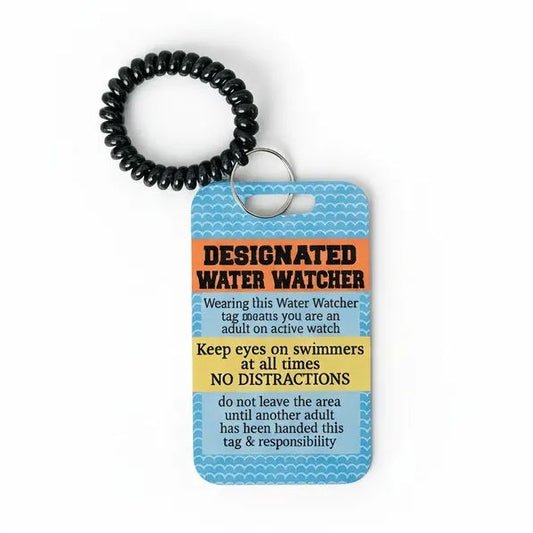 a blue tag with a black rubber band, which appears to be a water watcher tag. The tag has a warning message about wearing the water watcher tag on an active watch and keeping eyes on swimmers at all times, with the intention of preventing distractions.