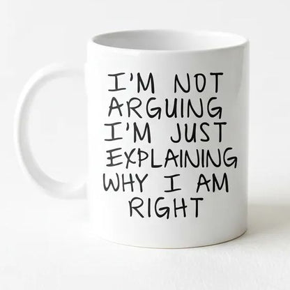 A white ceramic mug with black text printed on it.