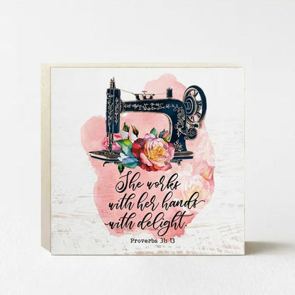 a sewing machine with a floral design, accompanied by a Bible verse from Proverbs 3:13.