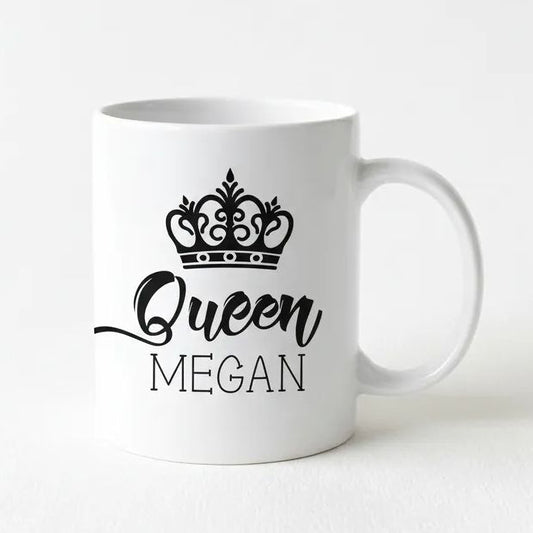 A white ceramic mug with a black crown design and the text "Queen Megan" printed on it.