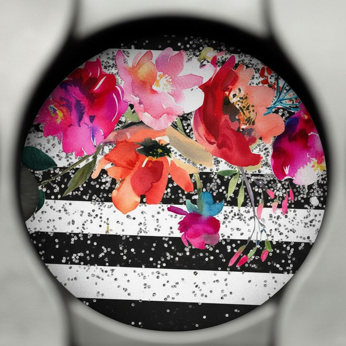 a vibrant floral arrangement with a variety of colorful flowers, including red, pink, orange, and white blooms, set against a black and white striped background.