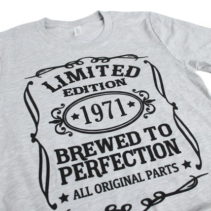 A grey t-shirt with a graphic design that reads "LIMITED EDITION 1971 BREWED TO PERFECTION ALL ORIGINAL PARTS".