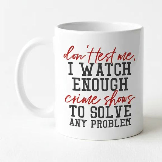 A white ceramic mug with text printed on it.