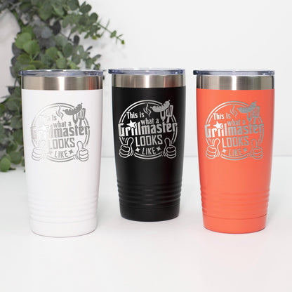 Three colorful tumblers with the text "This is what a Grillmaster looks like" printed on them.