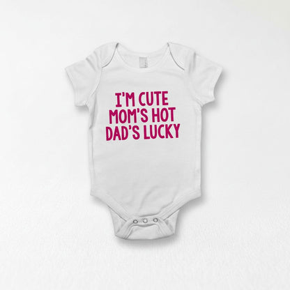 A white baby onesie with the text "I'm CUTE MOM'S HOT Dad's LUCKY" printed on it.