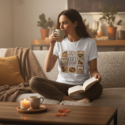 A woman sits on a couch, sipping a beverage and reading a book, with a cozy and inviting atmosphere.