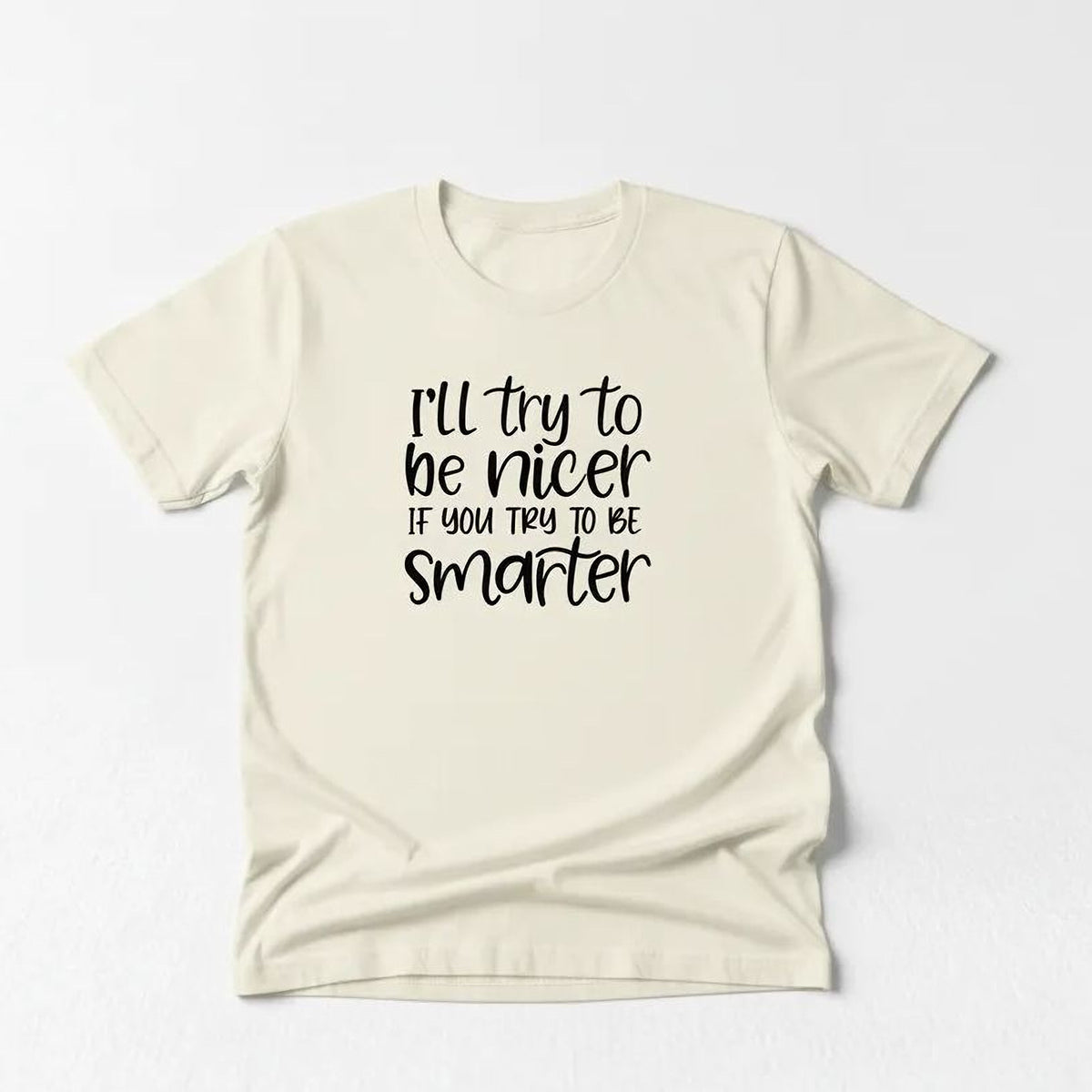 A white t-shirt with a black text message printed on it.