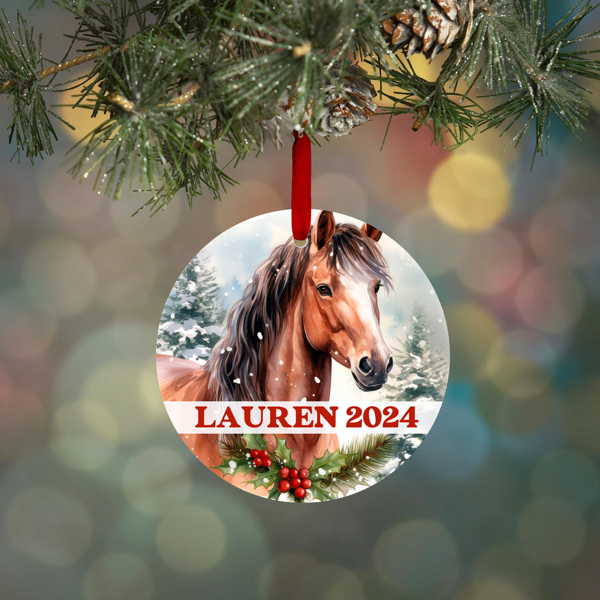 A round ornament featuring a horse's head with a snowy background and the name "Lauren" written below it.