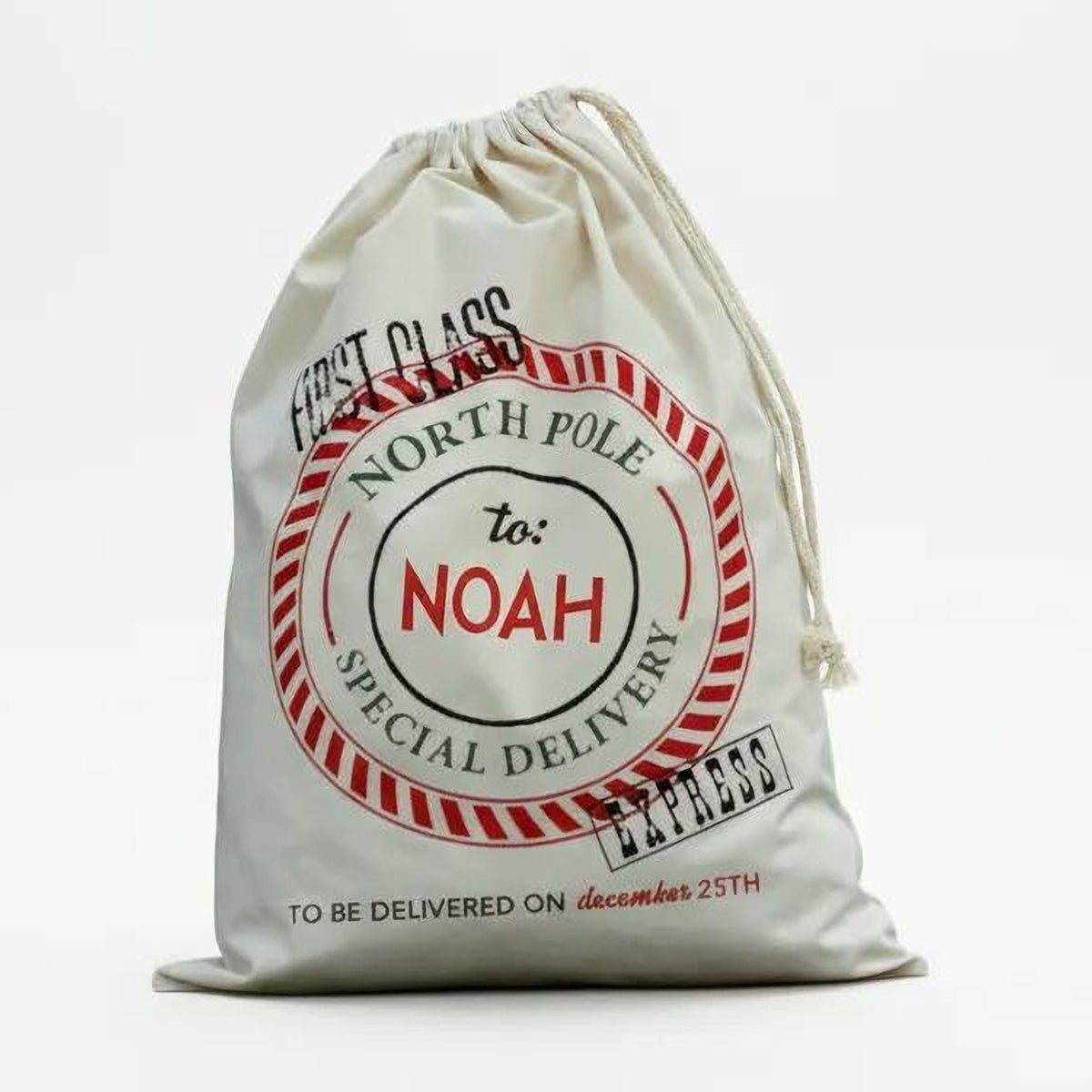 A white drawstring bag with a red and black label that reads "First class to Noah special delivery" and "TO BE DELIVERED ON december 25th".
