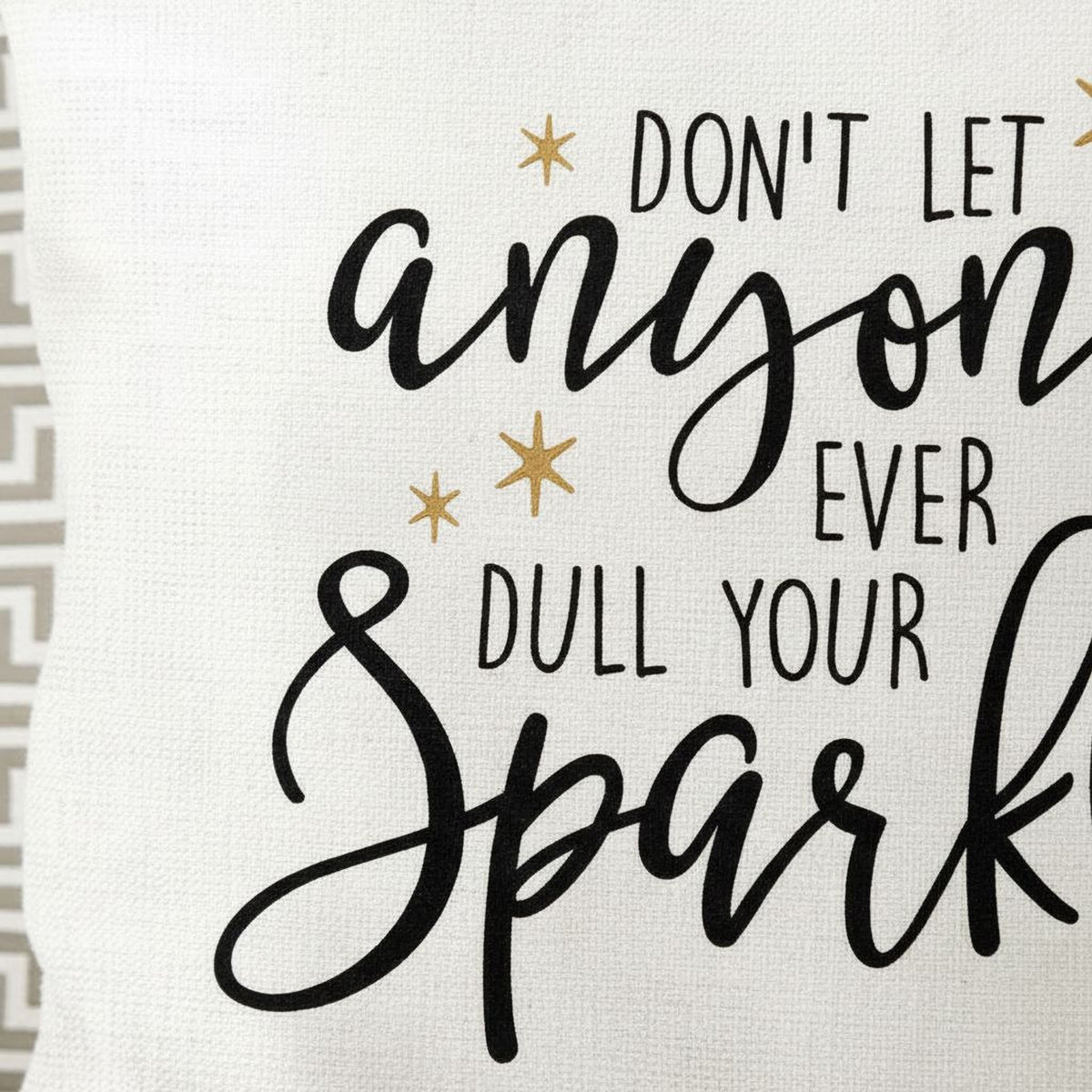 a quote in black text that says "DON'T LET ANYONE EVER DULL YOUR SPARK".