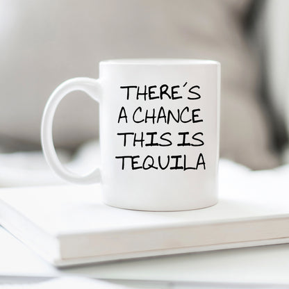 A white mug with the text "THERE'S A CHANCE THIS IS TEQUILA" printed on it.