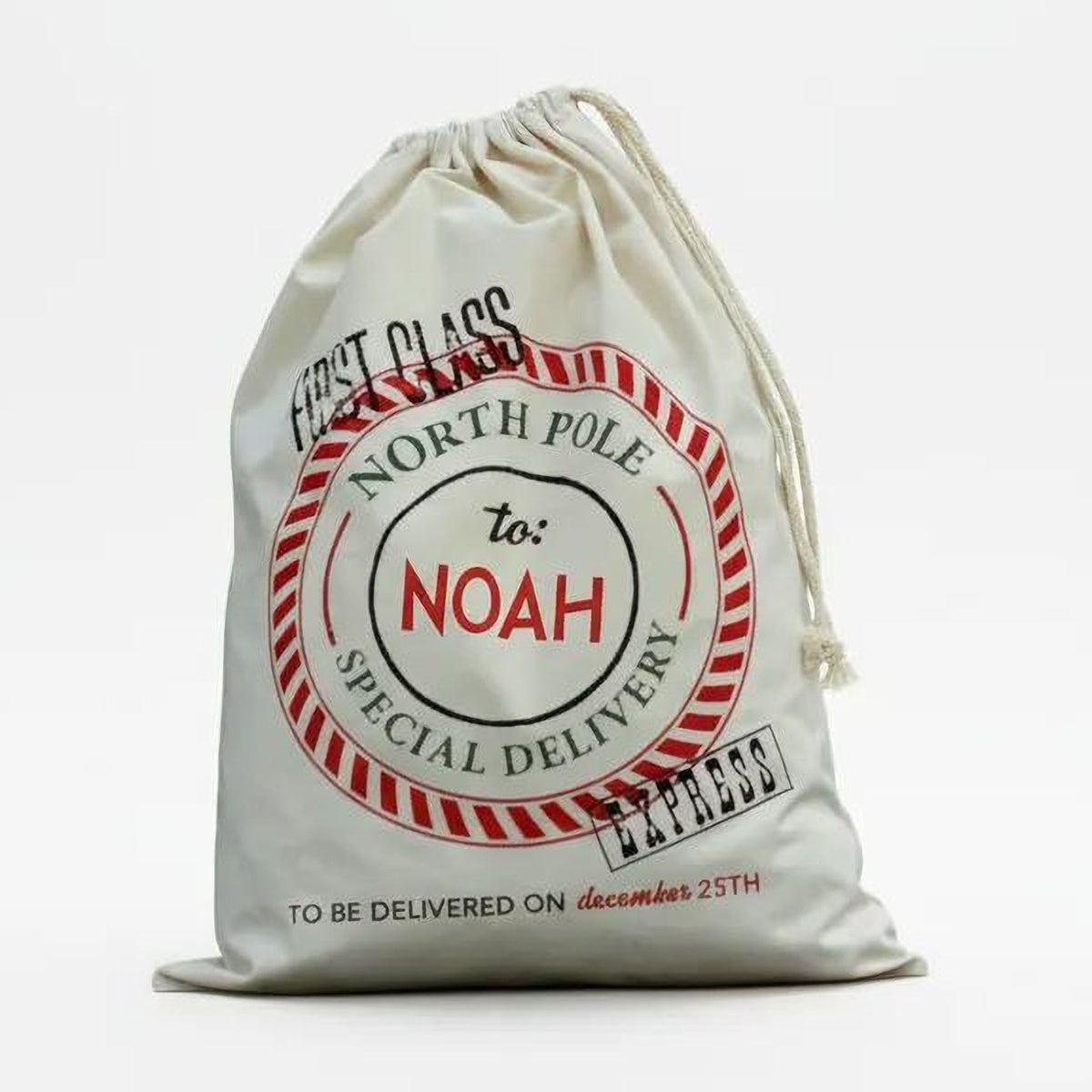 A white drawstring bag with a red and black label that reads "First class to Noah special delivery" and "TO BE DELIVERED ON december 25th".