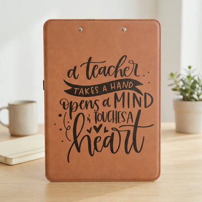 A brown clipboard with a motivational quote about a teacher.