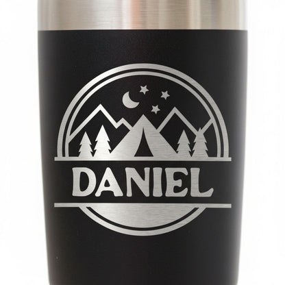 A black and silver tumbler with a personalized name and mountain landscape design printed on it.