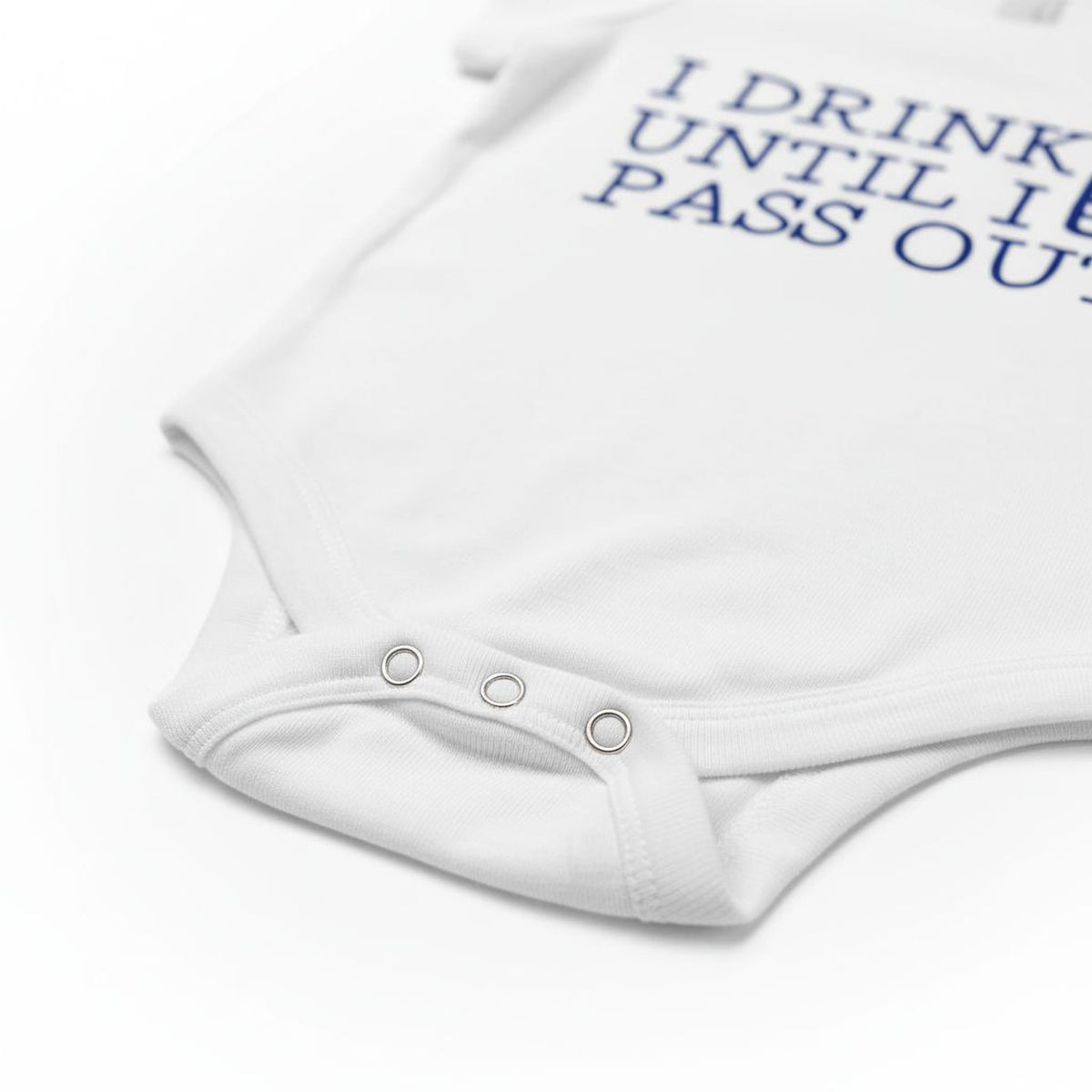 A white baby onesie with the text "I DRINK UNTIL I PASS OUT" printed on it.