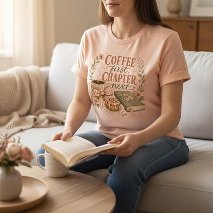 A woman is sitting on a couch, reading a book and holding a coffee mug.