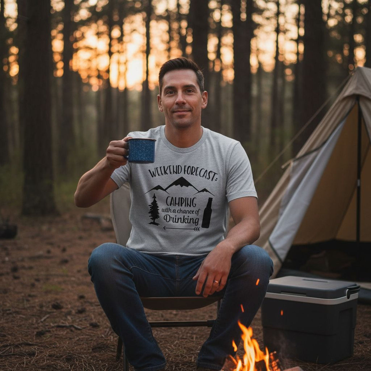 A man sits in a chair by a campfire, holding a mug, with a tent and forest in the background.